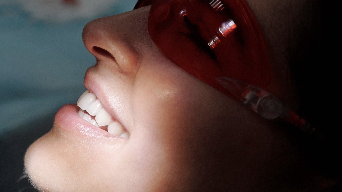 Dental patient wearing protective eyewear during restorative dental treatment